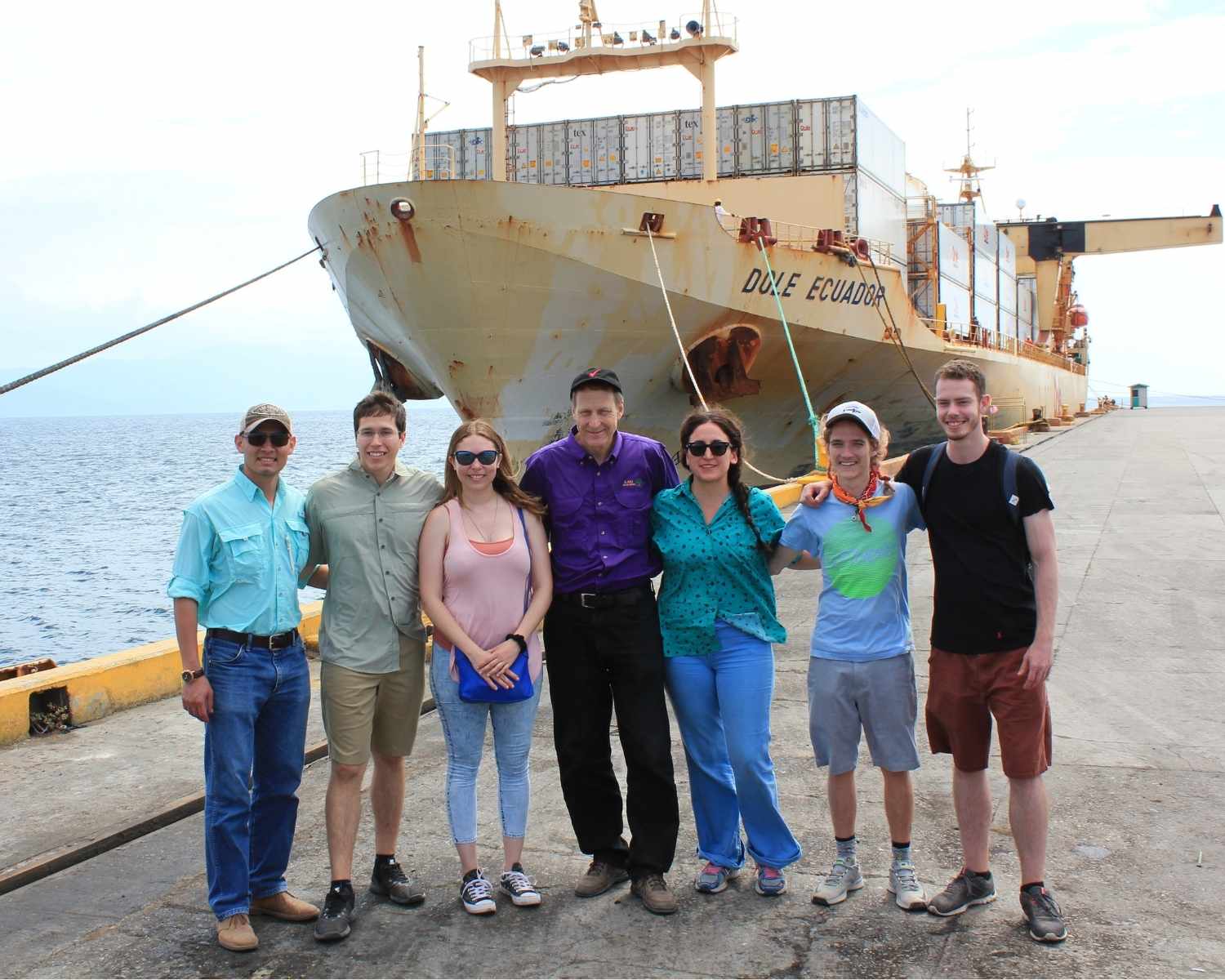 Group of students stand at port