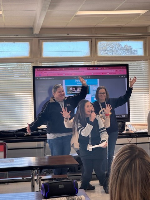 Educators dancing with students 