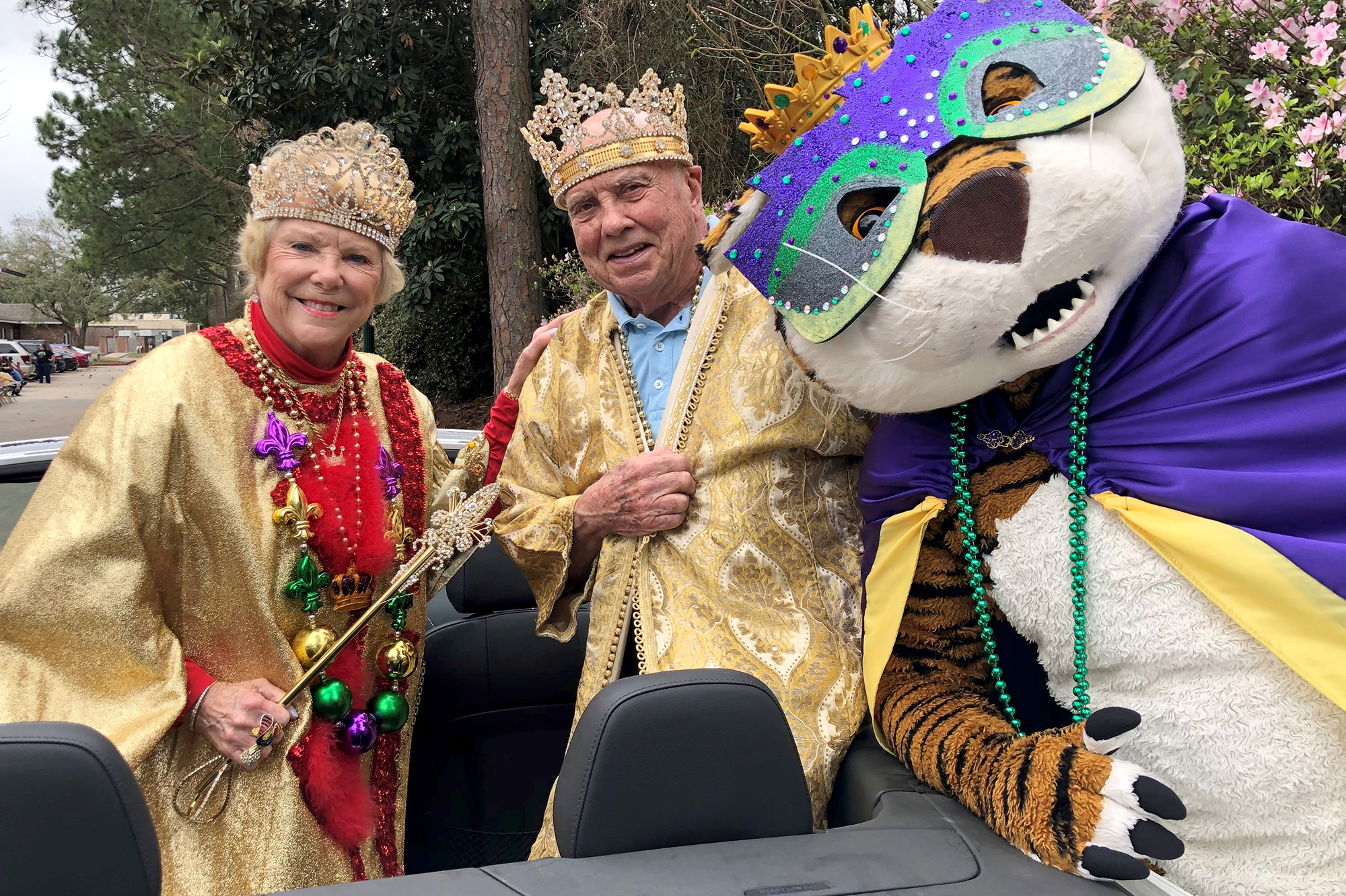 Mardi Gras king and queen with Mike the Tiger mascot