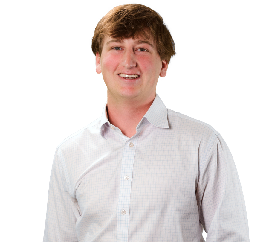 Eli Shortess is in a white shirt and smiling for a photo