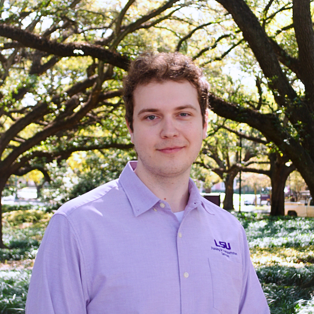 a man in purple polo