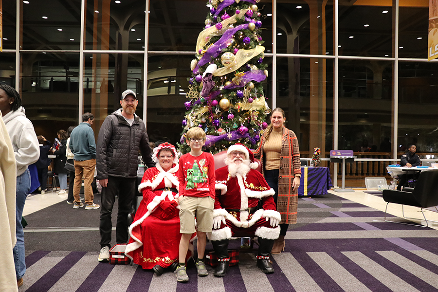 family with Santa and Mrs. Claus